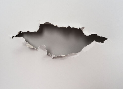 ripped hole in  paper background