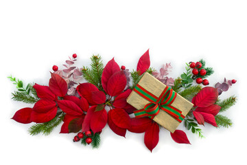 Christmas decoration. Gift box, red poinsettia flowers, christmas tree branch, red berries on a white background with space for text. Top view, flat lay