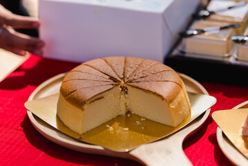 The large cake is divided into pieces so that the inside of the cake is visible.