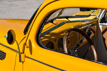 Inside of yellow vintage retro Ford V8 car
