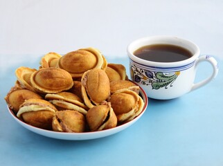 cup of hot coffee and tasty 
 cookies