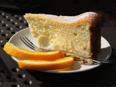 Slice Of  Cheese Cake With Orange Close Up