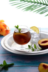 Iced tea with lemon and mint  peach flavor in summer .