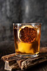 Whiskey with  ice   on  dark  background