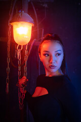 Fototapeta na wymiar Beautiful asian girl in the neon lights.