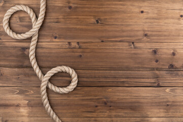 twisted rope on a wooden background isolated