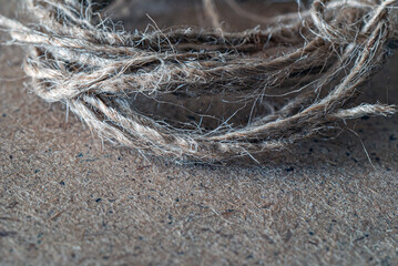 Thread on a wooden surface close-up