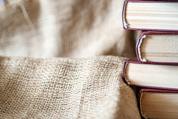 Books and burlap fabric close-up