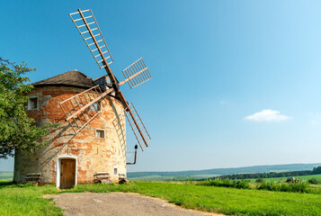 Fototapeta premium Czech landscape, old mill in Moravia fields