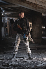 Fototapeta premium Soldier in the abandoned building. Post apocalypse soldier concept.