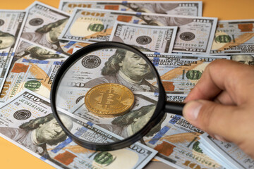 Bitcoin coin and American dollars