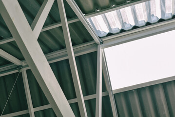Roof metal structure, Transparent acrylic roof, Factory or warehouse natural lighting construction for energy saving.