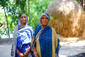 Bangladeshi hindu religious women wearing traditional dress, south asian female in outdoor environment
