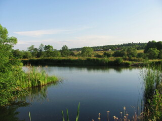 Naklejka na ściany i meble A beautiful pond in the village