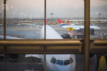 Jet aircraft at the boarding gate of Johannesburg International Airport in South Africa, the best airport in the African continent.