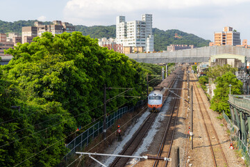 Naklejka premium Train pass though the Yingge District in Taiwan