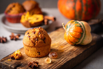 Homemade autumn pumpkin muffins with cinnamon and chocolate