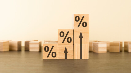 three wooden cubes with percent signs. concept of financial and mortgage interest rate. with copy space.