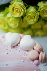 Fototapeta na wymiar Pink cake with heart and macarons
