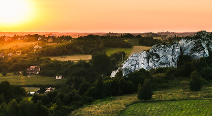Naklejka premium Sunset over the village near the limestone rocks.