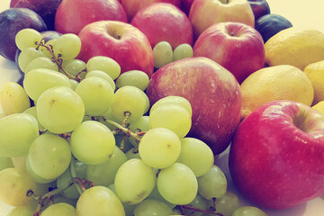 Ripe and juicy fruit. Grapes, lemons, apples. Vegetarian healthy natural food and ingredients for eating raw as salad, smoothie or juice
