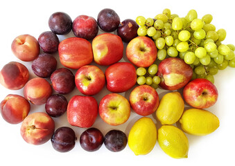 Ripe and juicy fruit. Plums, peaches, grapes, lemons, apples. Vegetarian healthy natural food and ingredients for eating raw as salad, smoothie or juice