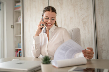 One woman caucasian businesswoman work in the office making phone call