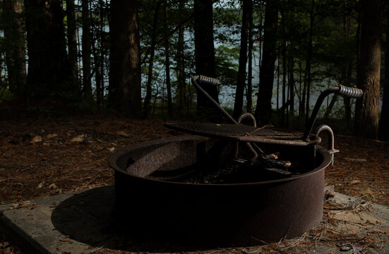 Unlit Fire Ring At A Campsite As Dusk Approaches