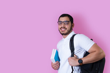 Positive arab guy student with backpack and books.