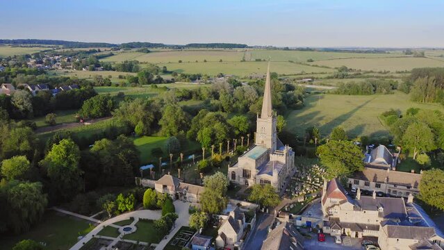 Aerial Drone View of Cotswolds Village and Burford Church in England, a Popular English Picturesque Tourist Destination in the Countryside of Gloucestershire