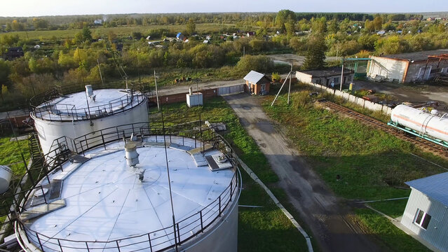 Aerial top view oil storage tanks. Stock. Top view of the large oil tanks
