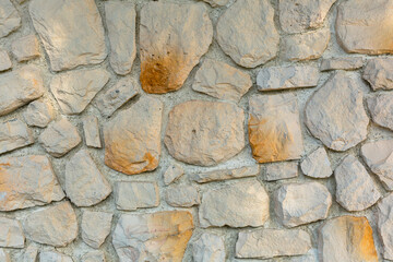 The texture of the stone wall. Background texture of the stone wall of the old building. Stone wall as background or texture.
