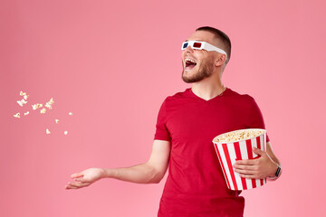 young man in 3d glasses throwing up and eating popcorn