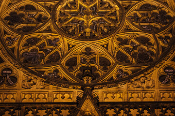 Stone lace of big  vitrage above the entrance to the Gothic Cathedral of St. Vitus at night