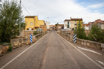 Fototapeta na wymiar a paved road entering Villanueva de Huerva, Campo de Cariñena, province of Zaragoza, Aragon, Spain