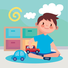little boy playing with cars
