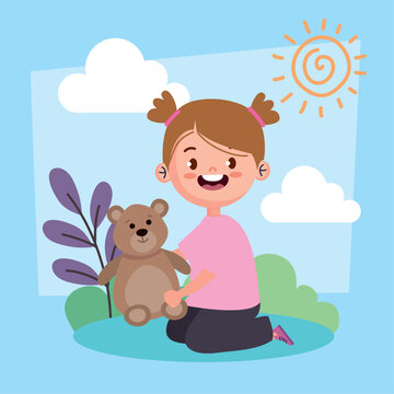 girl playing with teedy