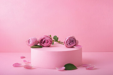 pink background with roses and podium for cosmetics and accessories