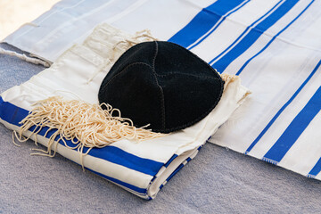 A Captivating Photo of a Jewish Kippah on a Traditional Jewish Scarf