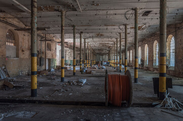 An abandoned old factory made of red bricks - a spinning mill in Poland