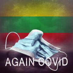 Inscription Again Covid and a crumpled medical mask on the flag of Lithuania. Return of the...