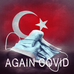 Inscription Again Covid and a crumpled medical mask on the flag of Turkey. Return of the...