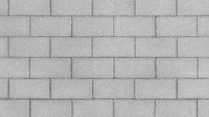 Fotobehang Beton Grey brick wall background close up. Gray stone tile block background with horizontal texture of gray brick. Gray brick surface.  © Hanna