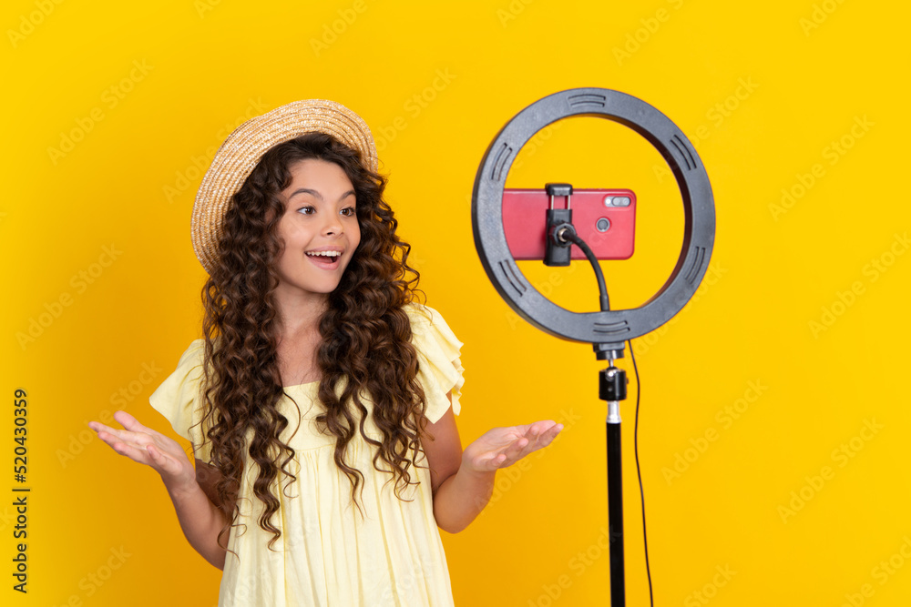 Canvas Prints teen girl blogger influencer use selfie led lamp and smartphone on tripod for making online video tu