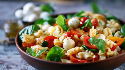 Pasta with tomatoes, mozzarella and basil. Italian food.