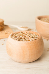 Bowls with wholegrain spelt farro on wooden table