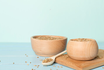 Bowls with wholegrain spelt farro on wooden table