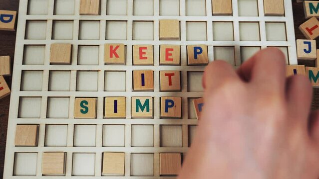 Keep it simple. Good advice concept. Colourful wooden square letters creating strong message. High quality 4k footage