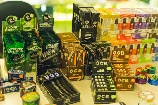 05.28.2022 Warsaw, Poland. Display of numerous medical marijuana related products. Colourful crashers, rolling papers of different sizes and flavors. High quality photo
