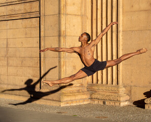 Leaping to a new day, a metaphor embodied by a magnificent male ballet dancer